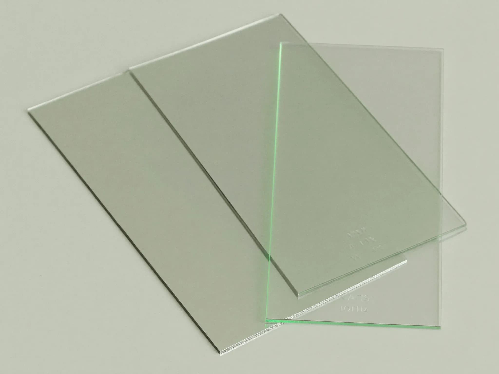 Blank translucent cards catching pale light